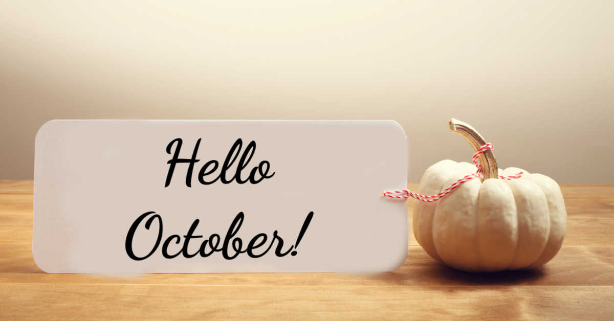 Hello October! White pumpkin with a card that says "Hello October!"