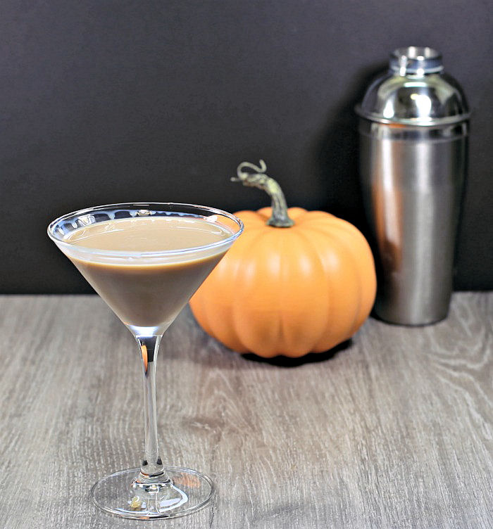 Making a Ghostbuster cocktail Ghostbuster cocktail with pumpkin nd cocktail shaker.