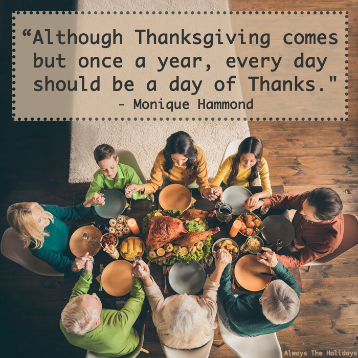 A family sitting around a Thanksgiving table holding hands in prayer with a Thanksgiving thankful quote text overlay.
