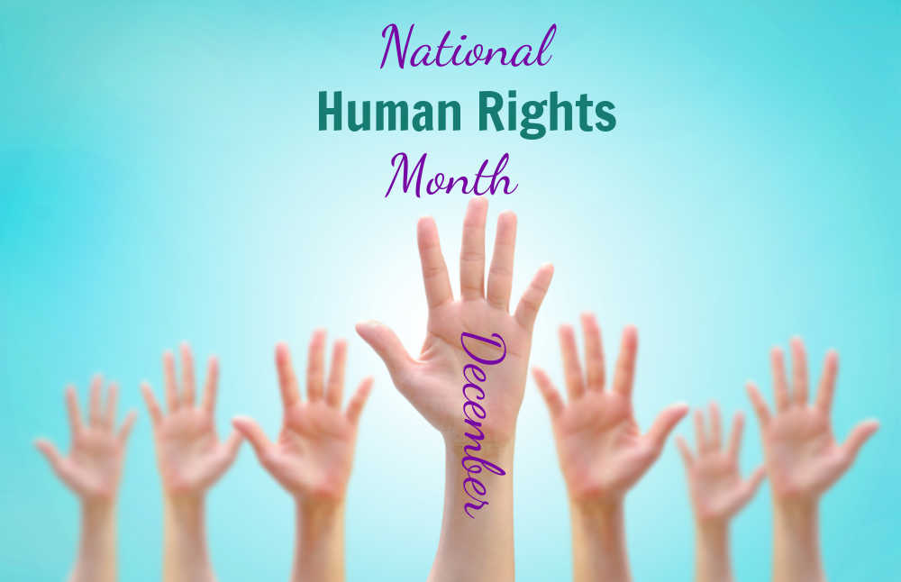 National Human Rights Month Row of open hands in the air with words National Human Rights Month and the words December on one arm.