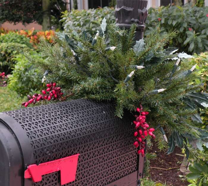 Decorated mailbox with lights. Black mailbox decorated with lights for the holidays.