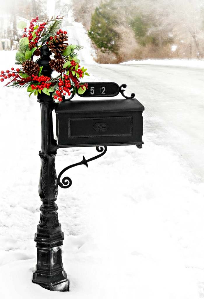 Decorated black mailbox for Christmas Black mailbox decorated with a Christmas wreath.