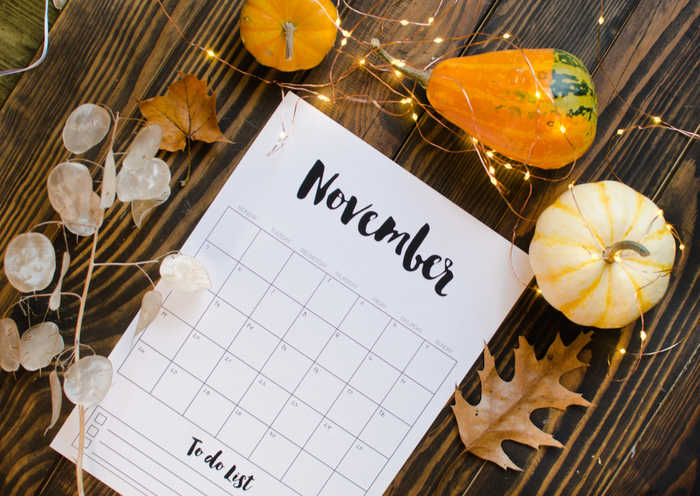 More November days November calendar with pumpkins and leaves.
