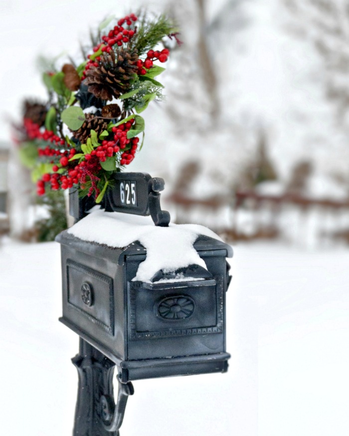 Swag wreath on a black mailbox. Black mailbox with swag wreath for Christmas.