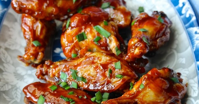 Air fryer chicken wings on a white plate.