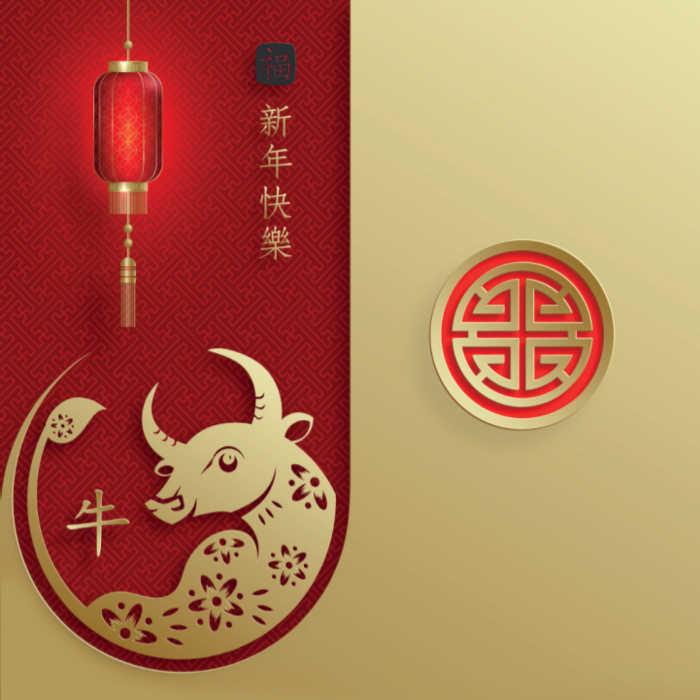 gold ox on a red inset in a square card.