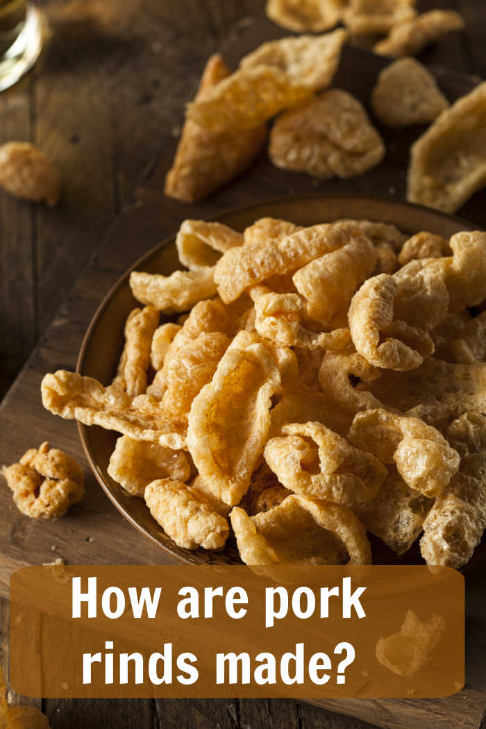 How are pork rinds made? Pork rinds on a wood board with text reading "how are pork rinds made?"