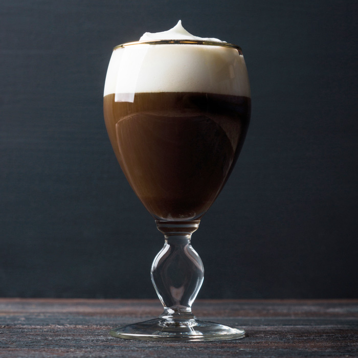 Irish coffee in the original Irish coffee glass. Irish coffee in the original Irish coffee glass.