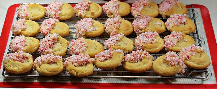 White chocolate peppermint cookies on a wire rac,k Valentine's Day white chocolate peppermint cookies on a wire rack over a silicone baking sheet.