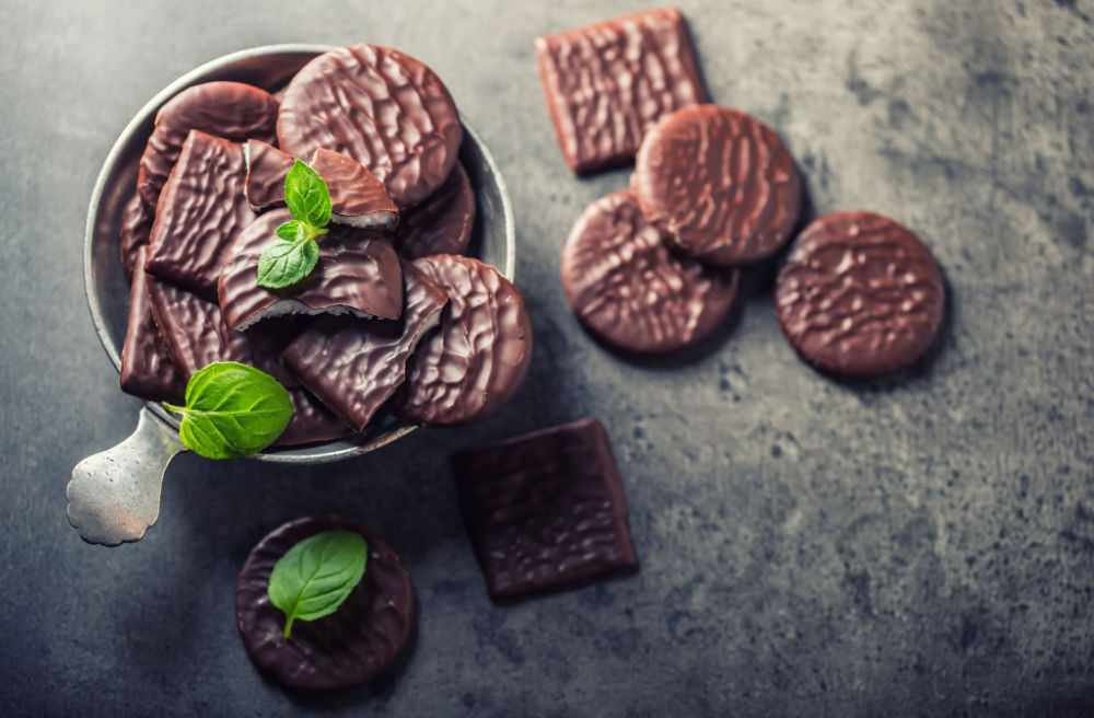 Chocolate mint cookies and sprigs of mint. Chocolate mint cookies with mint sprigs.