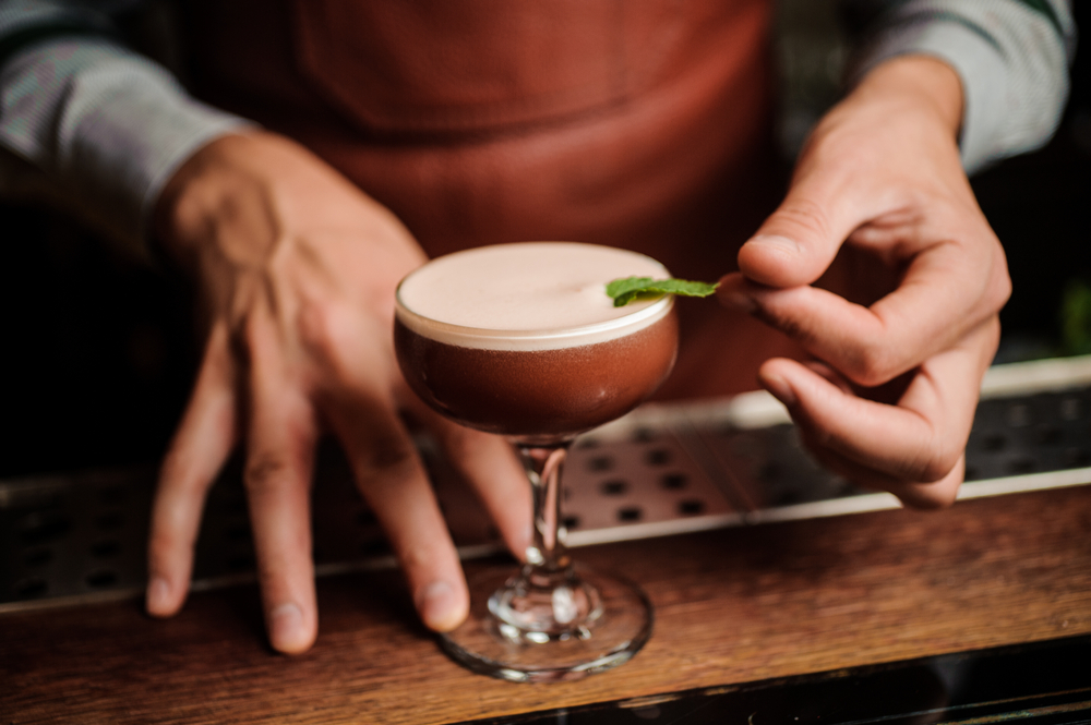 A cocktail in a coupe glass as a toast to the father of bartending.