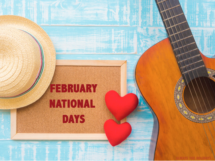 February National Days A cork board reading "February National Days" between a sun hat and an acoustic guitar.