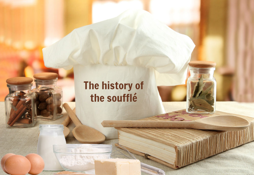 Chef hat, books, spices, eggs, butter and flour with words reading History of soufflés.