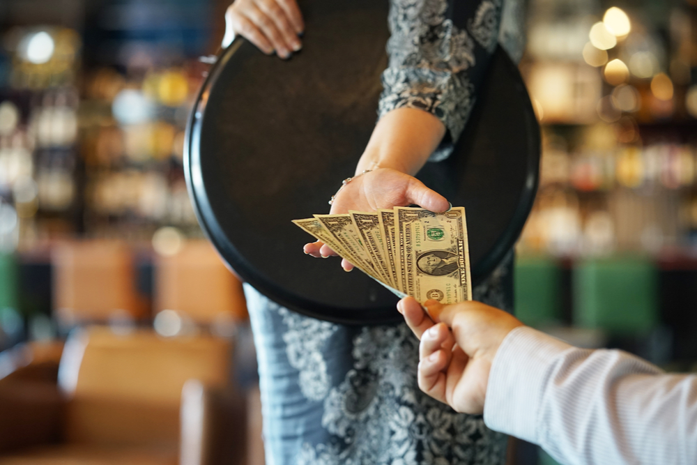 A photo showing how much to tip a bartender.