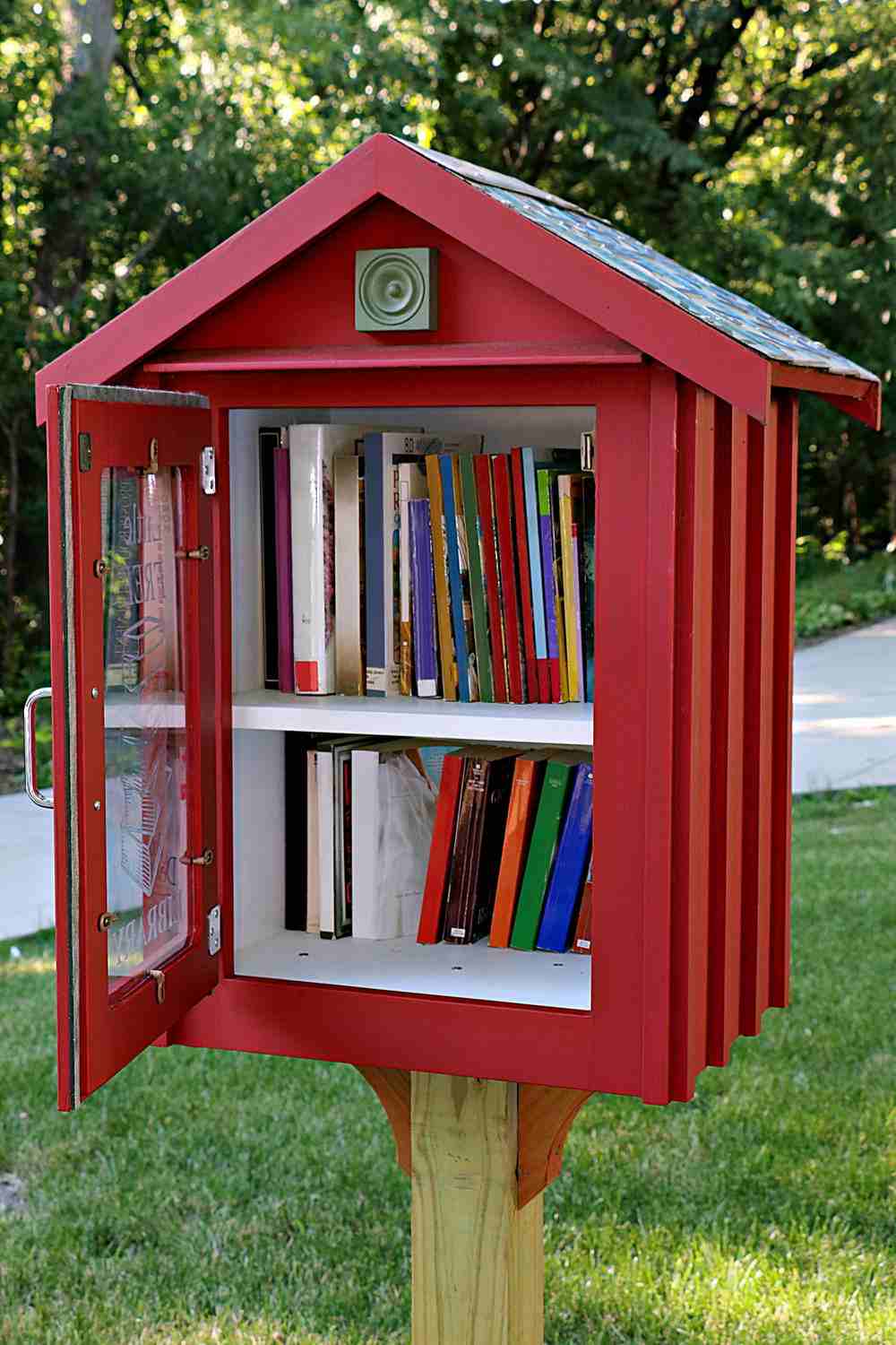 A little library with the door open showing where to donate books.