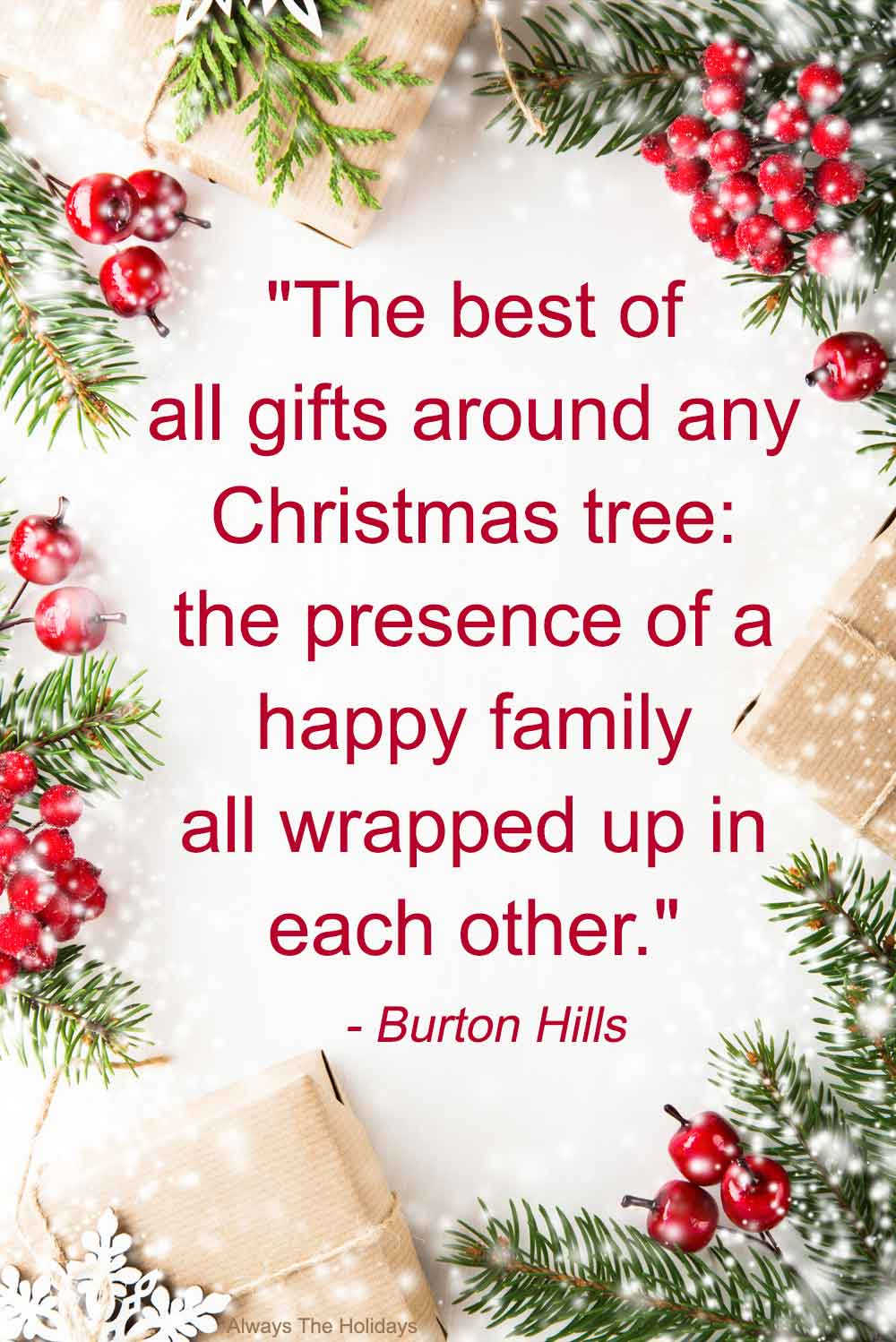 A white glittery background with a Christmas family quotes on it, surrounded by berries, holly, pine boughs and wrapped presents.