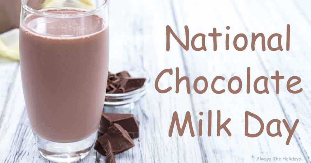 A glass of a chocolate milk on a white wooden background next to chocolate with a text overlay that reads "National Chocolate Milk Day".