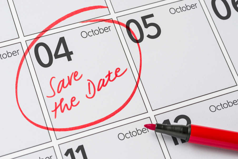 October 4 calendar day circled. October 4th circled on a calendar with red pen, and a note written on the day that says "save the date".