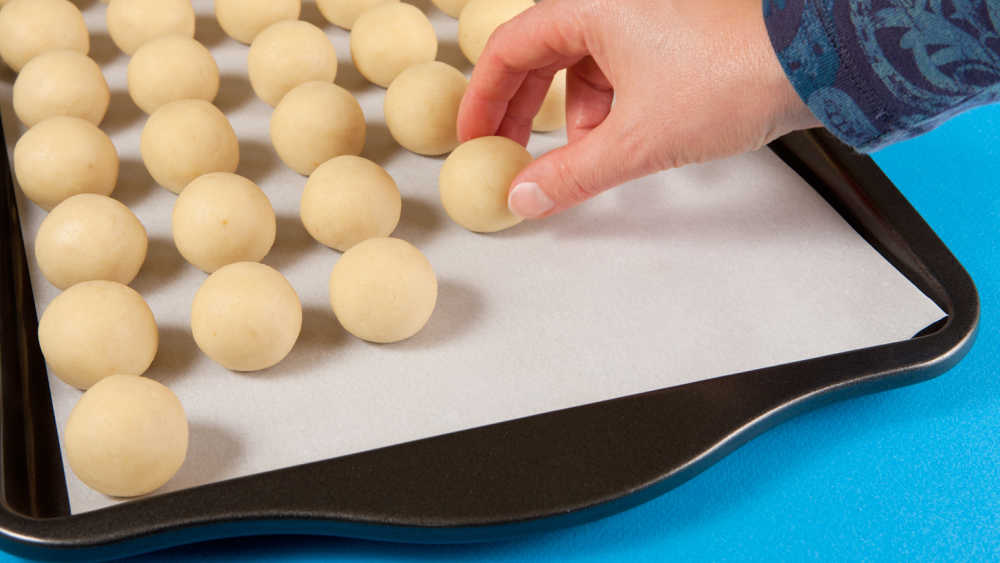 Cake balls on parchment paper.