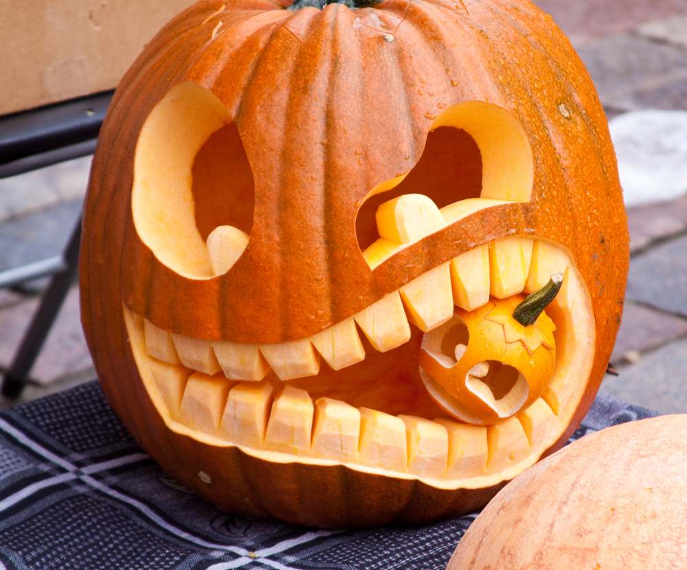 Scary jack o lantern. A scary jack o lantern eating a baby jack o lantern.