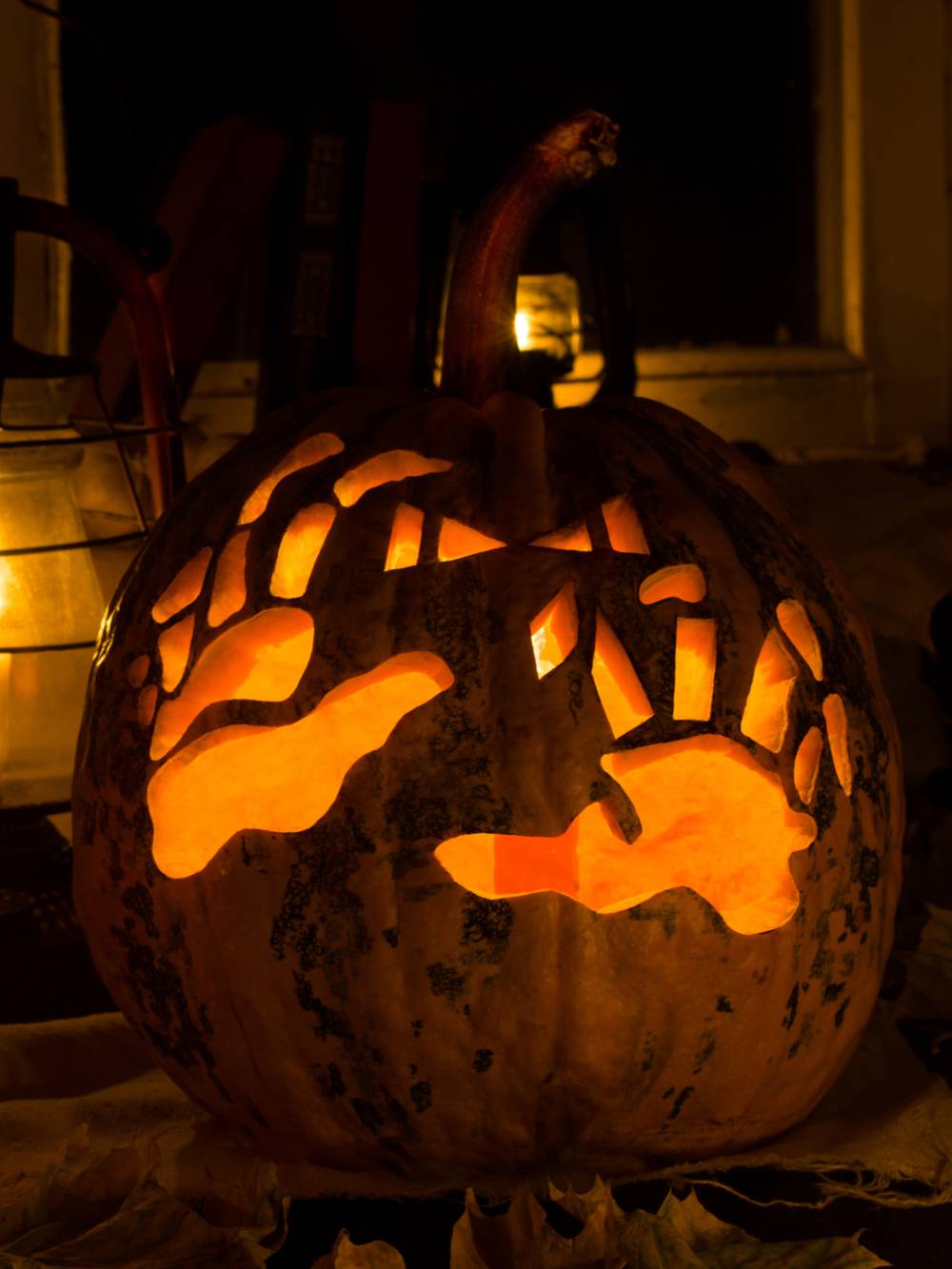 Skeleton hands carved on pumpkin. A skeleton pumpkin carving featuring skeleton hands.