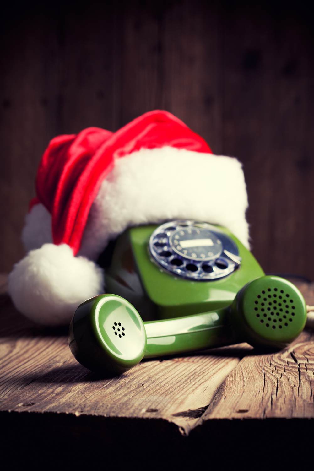 Rotary phone with Santa hat. A green rotary phone with a Santa hat on it, to advertise that fact that there is a Santa phone number where you can call Santa.