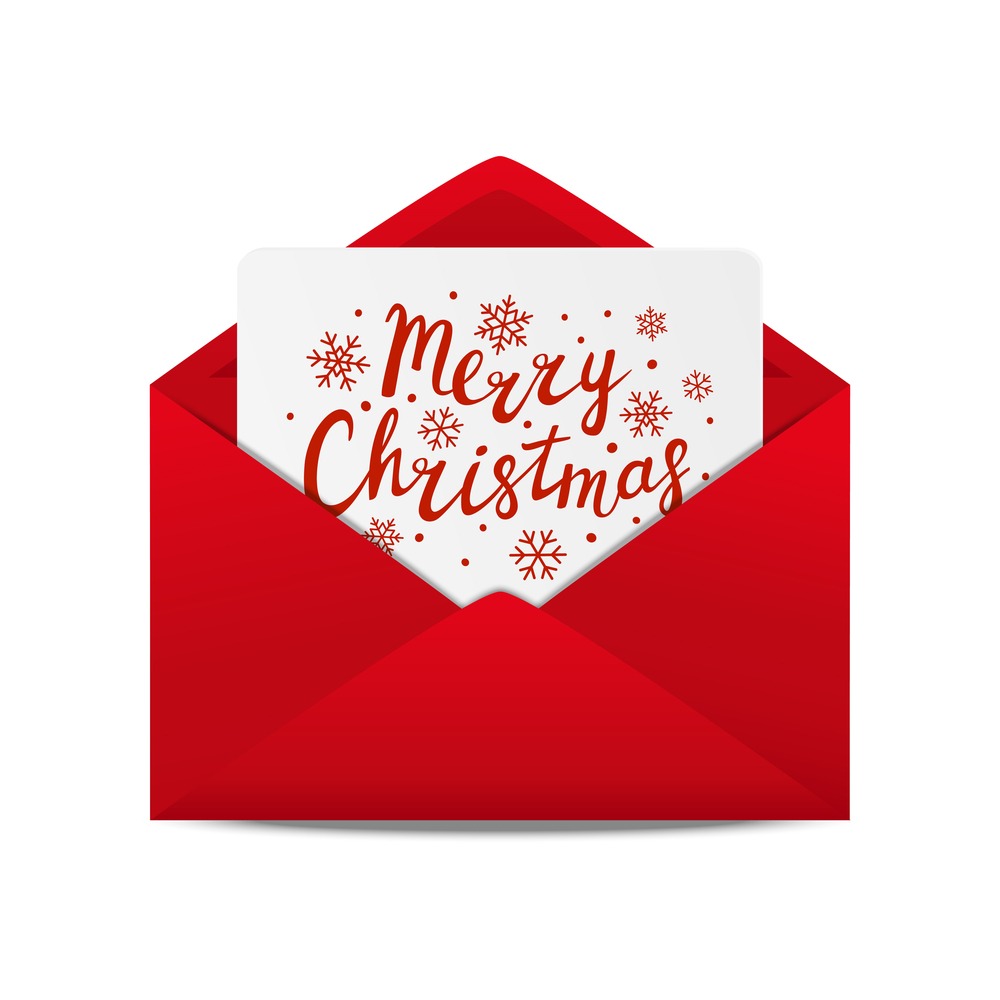 Christmas card in red envelope A red envelop with a white Christmas card that reads "merry Christmas" with red snowflakes.