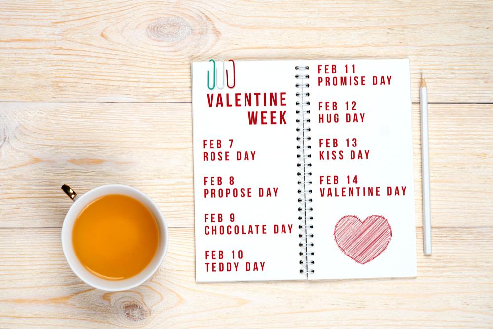 Valentine's Week list A notebook with the days of Valentine's Week written on it, starting with Rose Day and ending with Valentine's Day.