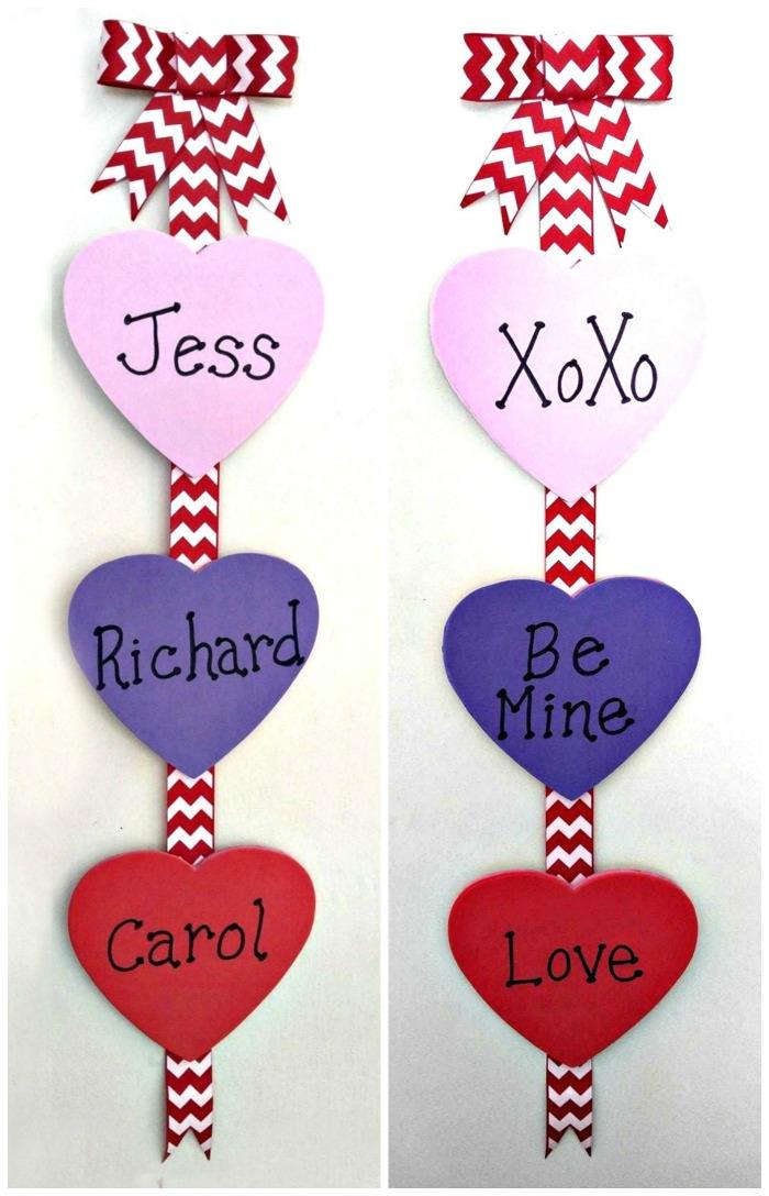 Valentine's Day craft project Two DIY Valentine's Day themed wall hangings made of red and white ribbons with hearts in Valentine's Day colors spaced out on them.