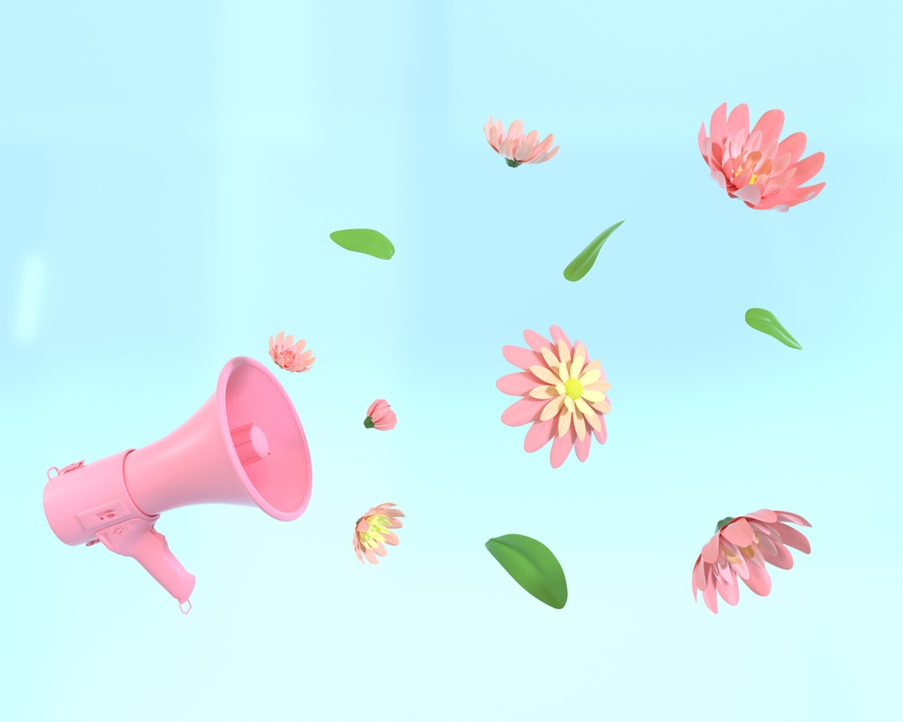 Megaphone and flowers A pink microphone with pink flowers and green leaves coming out of it to symbolize floriography (the language of flowers) against an aqua blue background.