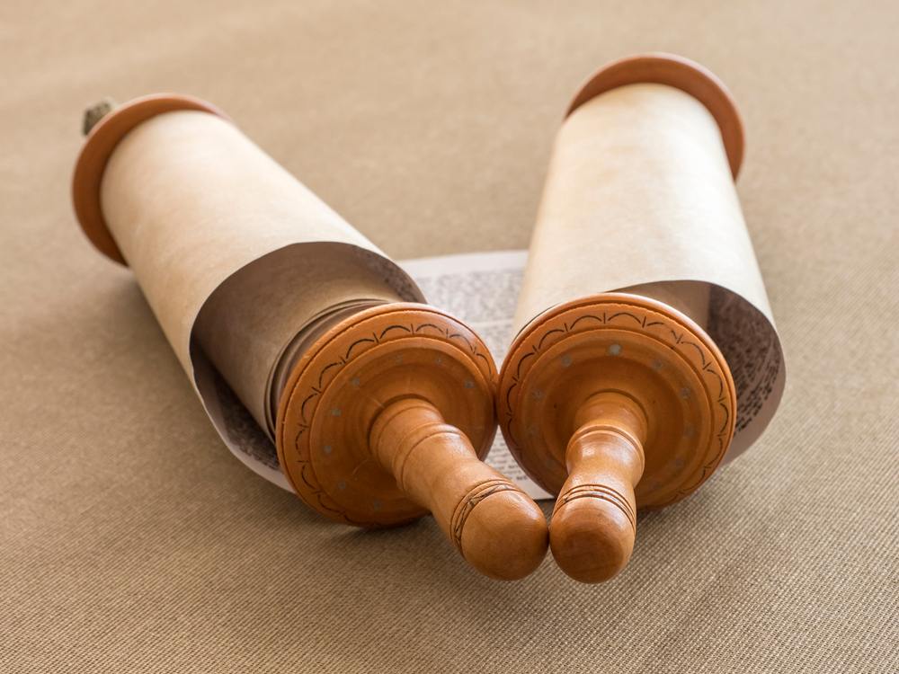 Parchment scroll A scroll of paper which has writing about ancient Greek and Roman mythology on it.