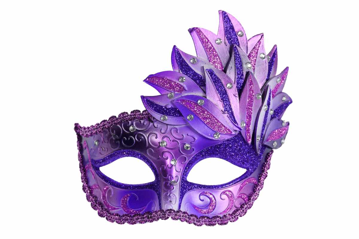 A purple Mardi Gras mask with feathers on a white background.