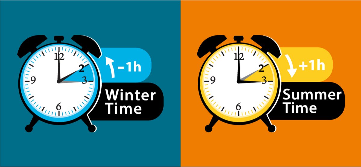 Summer time and winter time graphic Two daylight saving time clocks set to 2am, the one on the left is in blue and has the words "winter time" beside it while the one on the right is in orange and has the words "summer time" next to it.