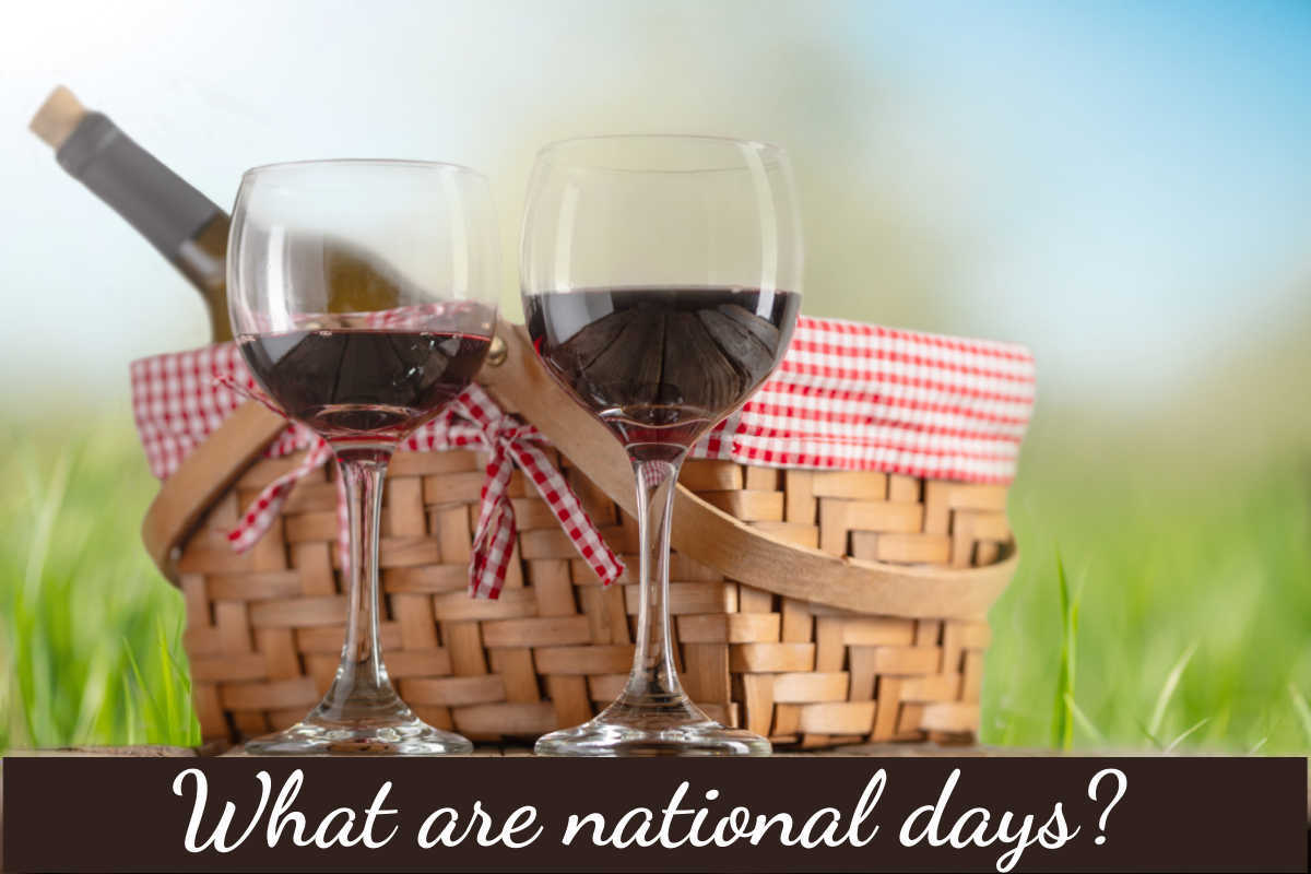 What is a national day Two glasses of red wine near a picnic basket with words "What is a national day?"