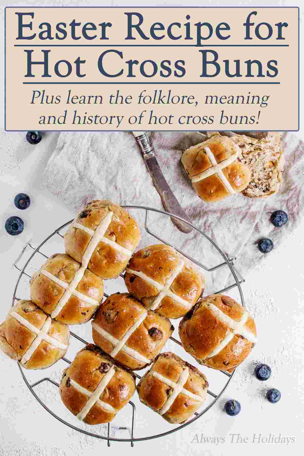 Eater Recipe for Hot Cross Buns A cooling rack of hot cross buns with a text overlay that reads "Easter Recipe for Hot Cross Buns, plus learn the folklore, meaning and history of hot cross buns".