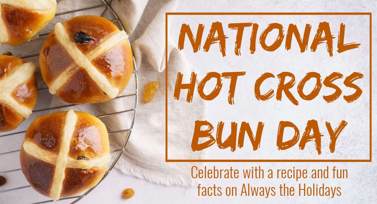 Hot cross buns with text overlay A close up image of a homemade hot cross buns recipe on a cooling rack with a text overlay for National Hot Cross Buns Day.