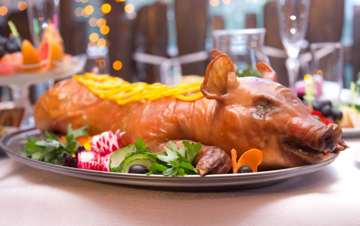 Suckling pig day Roast suckling pig on a platter.