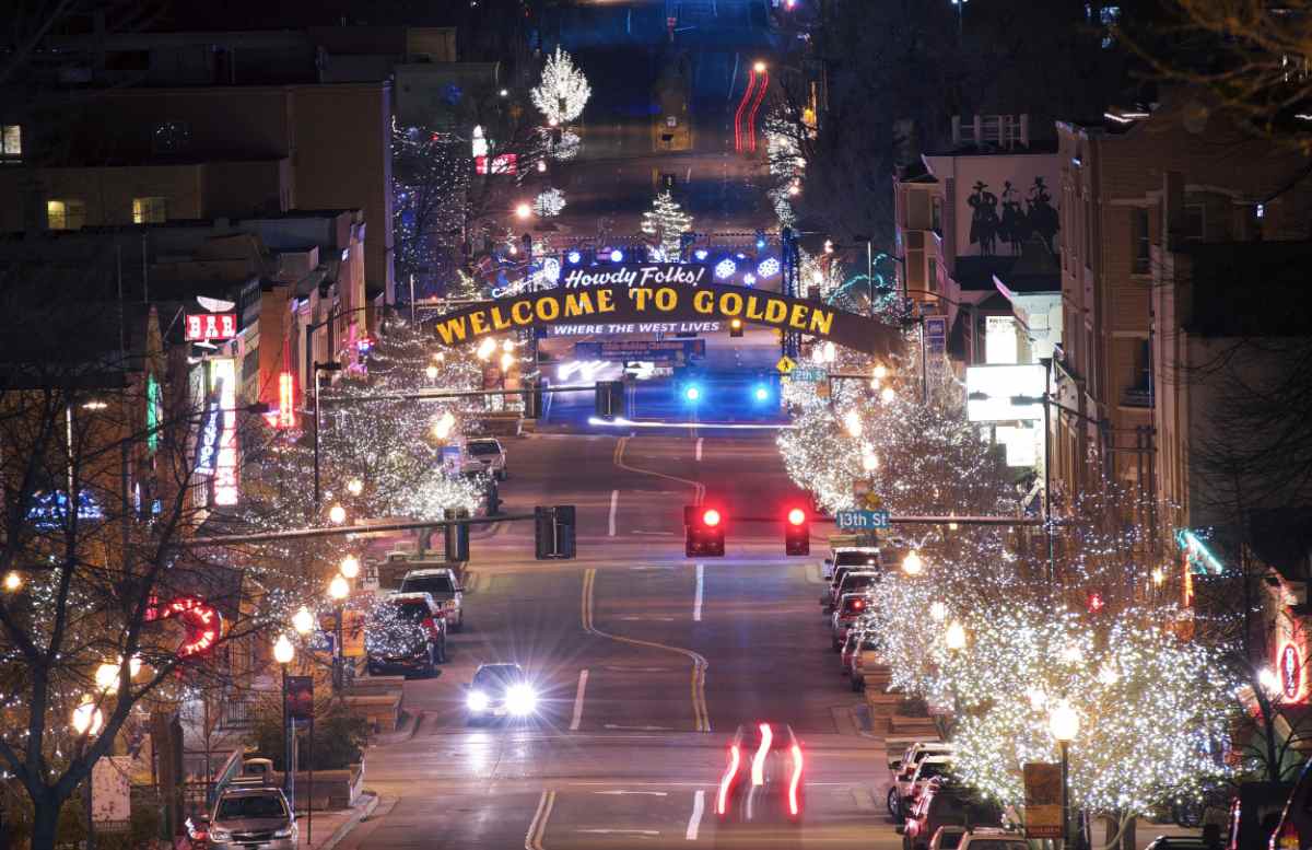 Golden, Colorado arch An overhead view of the arch that says "Welcome to Golden" stretching over an empty street in Golden, Colorado where every year hundreds of Colorado golden retrievers (and visiting retrievers) gather for National Golden Retriever Day.