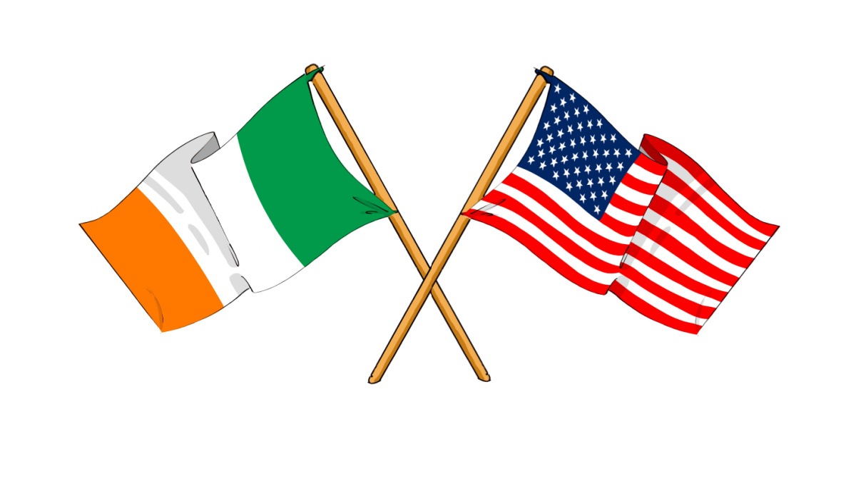 Flags of Ireland and the United States of America A tricolor flag of Ireland and a flag of the United States of America crossed at their flagstaffs, to represent the combination of the two places, celebrating Irish Americans.