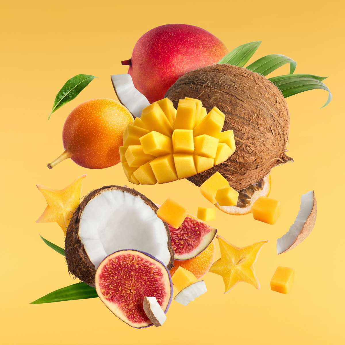 Tropical fruit Various botanicals used to make flavored rum floating in the air against a yellow background, including but not limited to coconut, mango and orange.