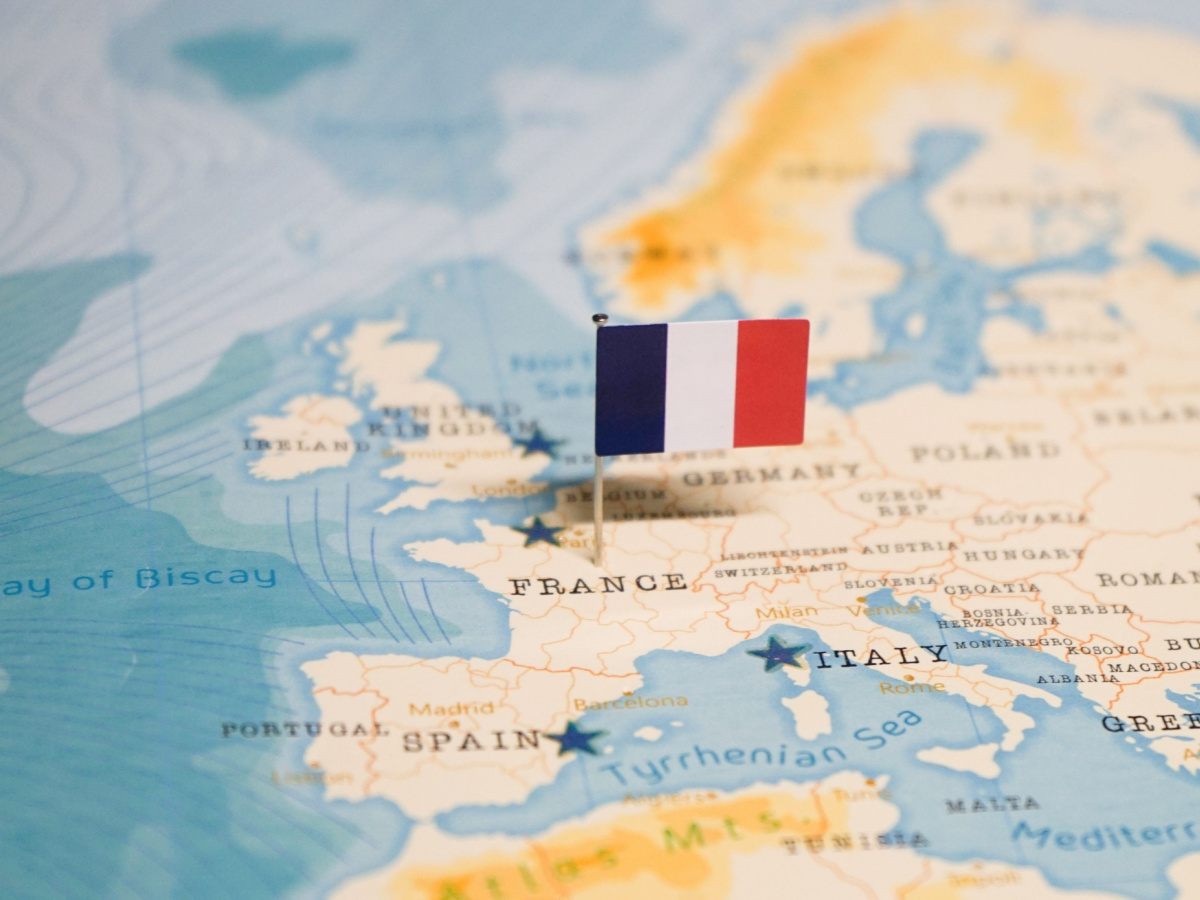 Map of France A map of France with a French flag pushpin in the center of the country.
