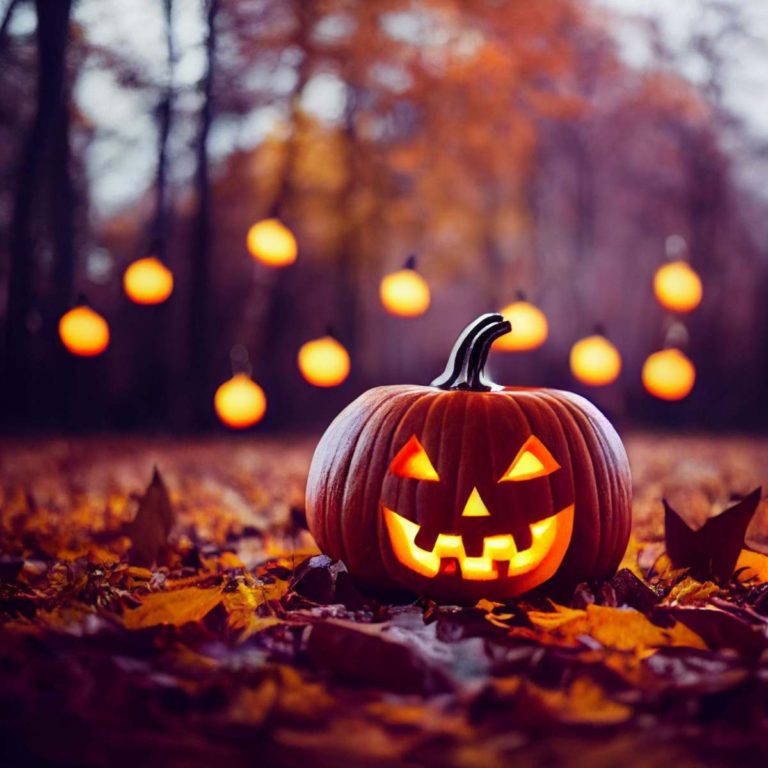 A carved jack o lantern sitting in the woods with ghost lights behind it.