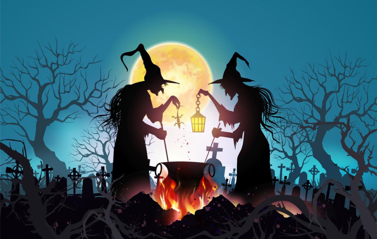Two witches Two witches standing around a cauldron wearing pointed hats, one holding a lantern and one holding a lizard.