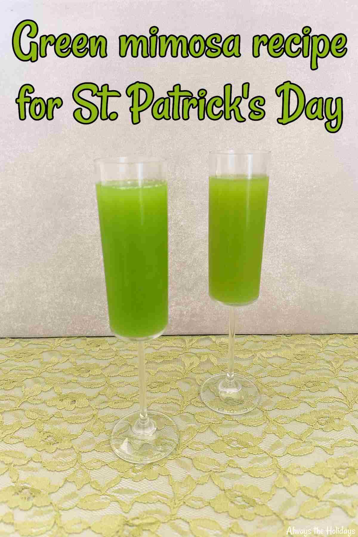 Learn How to Make a Green Mimosa for St. Paddy's Day Two champagne flutes filled with green mimosas, for a festive St. Patrick's Day drink against a stone background, sitting on green lace.