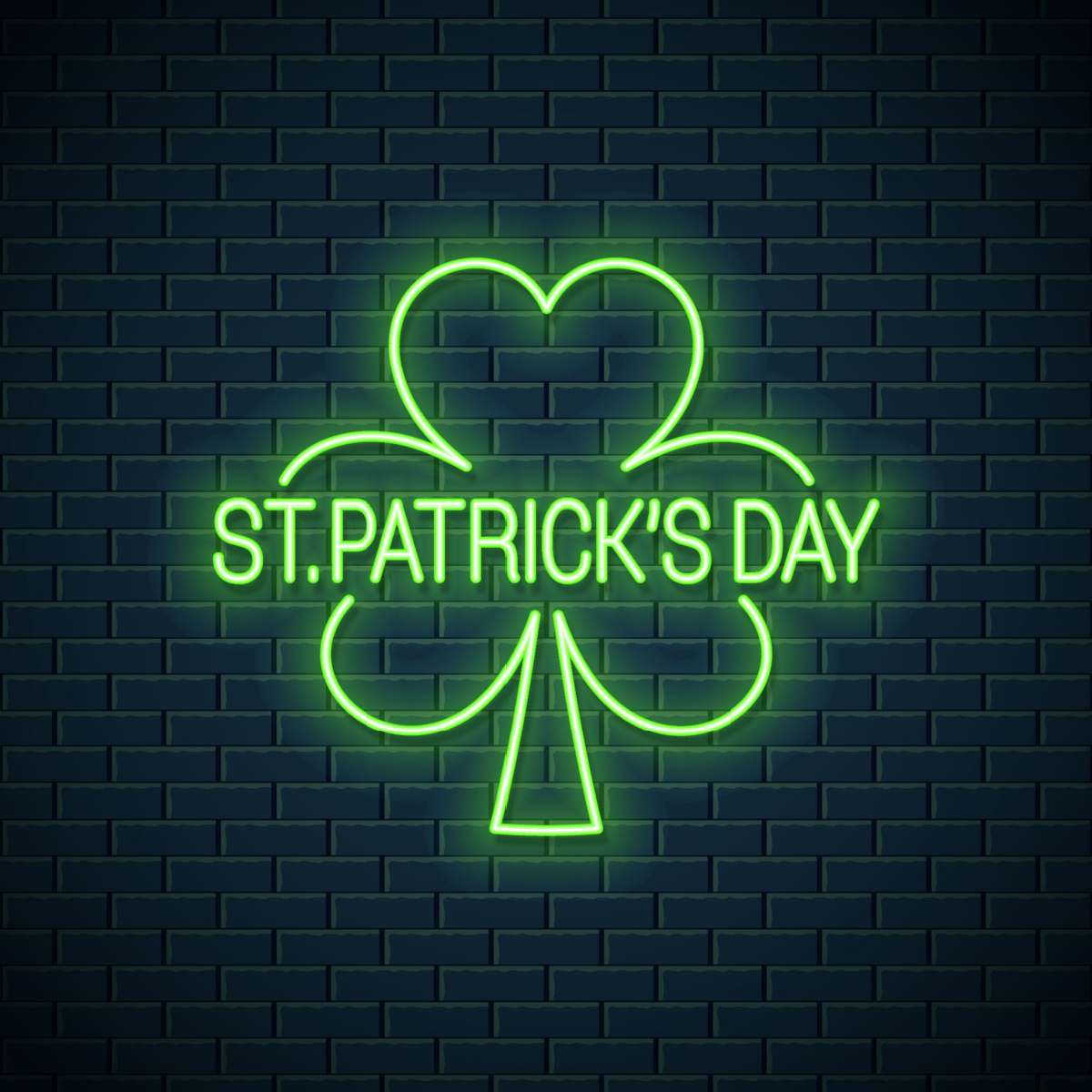 Neon shamrock A black brick wall with a neon shamrock sign that says St. Patricks Day in the center of it.