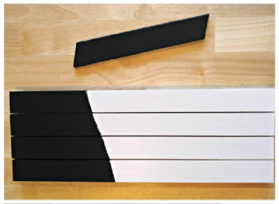 wooden pieces of wood painted white and black