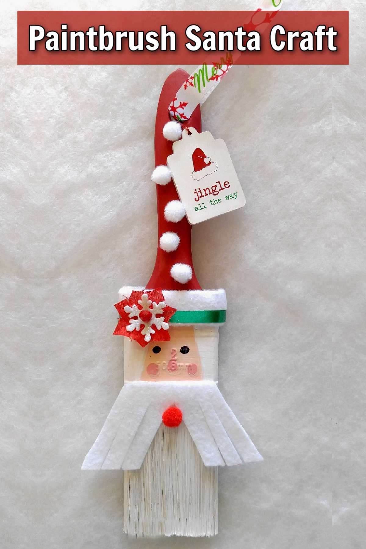 Paintbrush Santa Craft Project A cute Christmas ornament of Santa Claus on white background and text readying Paintbrush Santa Craft.
