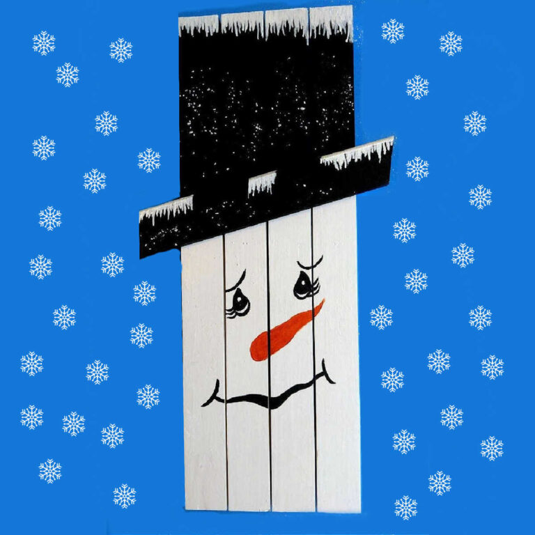 Cute wooden snowman decor project with snowflakes surrounding it.