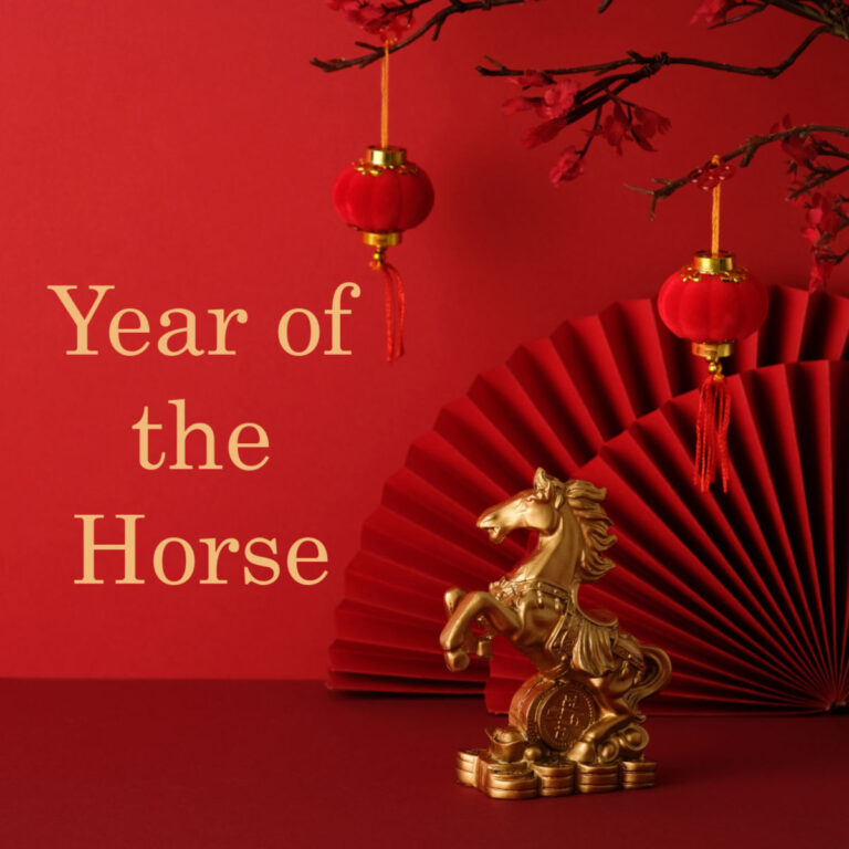 A golden horse on a red background with red lanterns and fans and gold text reading Year of the Horse.
