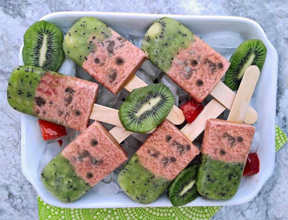 Watermelon popsicles A white plate of six watermelon popsicles for summer.
